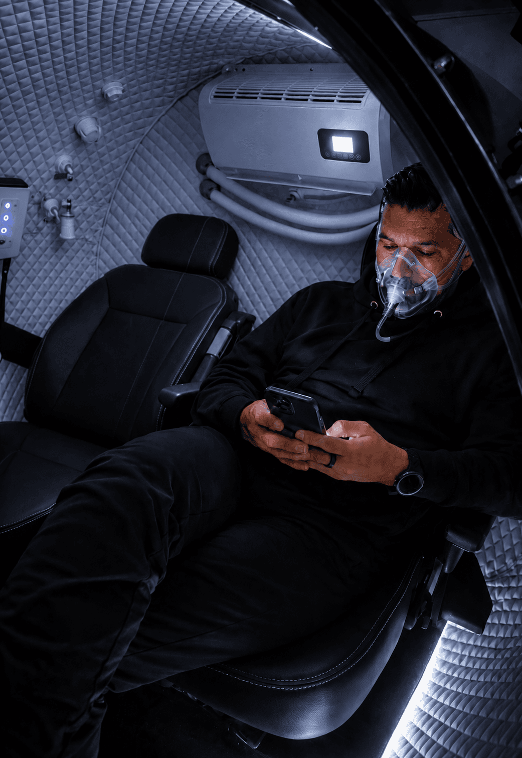 Man inside hyperbaric oxygen chamber at Eleve