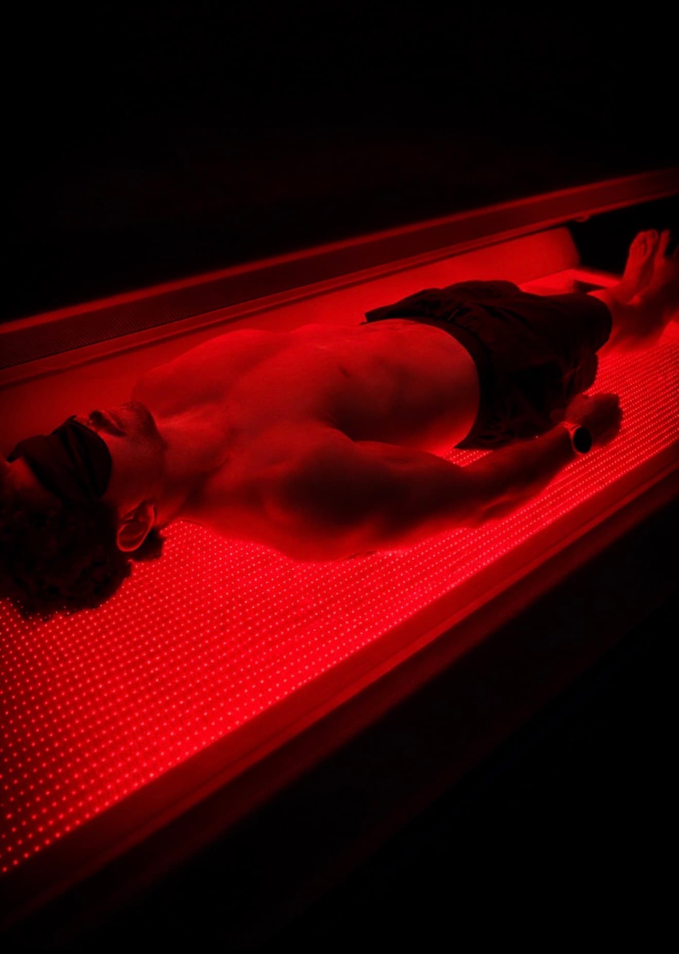Person receiving red light therapy at Eleve Newport Beach
